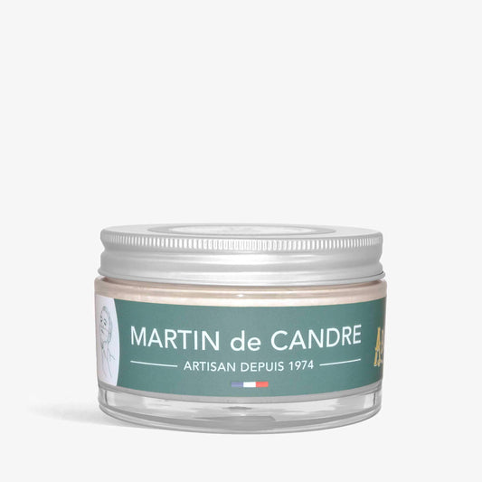 A jar with a green label featuring Martin de Candre Absinthe shaving soap on a white background