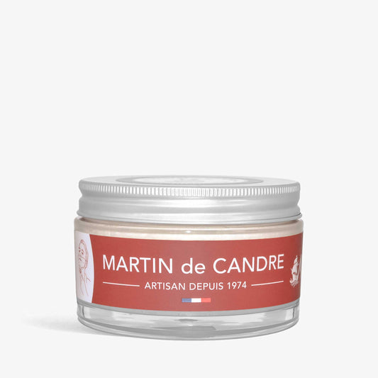 A jar with a red label featuring Martin de Candre Magellan shaving soap on a white background