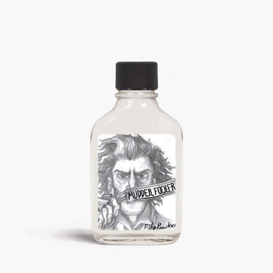 A bottle of Razorock Mudder Focker aftershave splash with a black lid on a white background