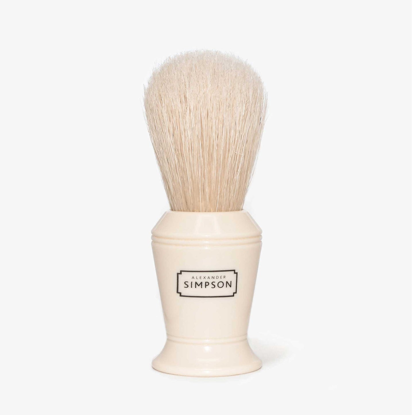 Simpson Barbican boar bristle shaving brush with ivory coloured handle and bleached bristles on a light gray background